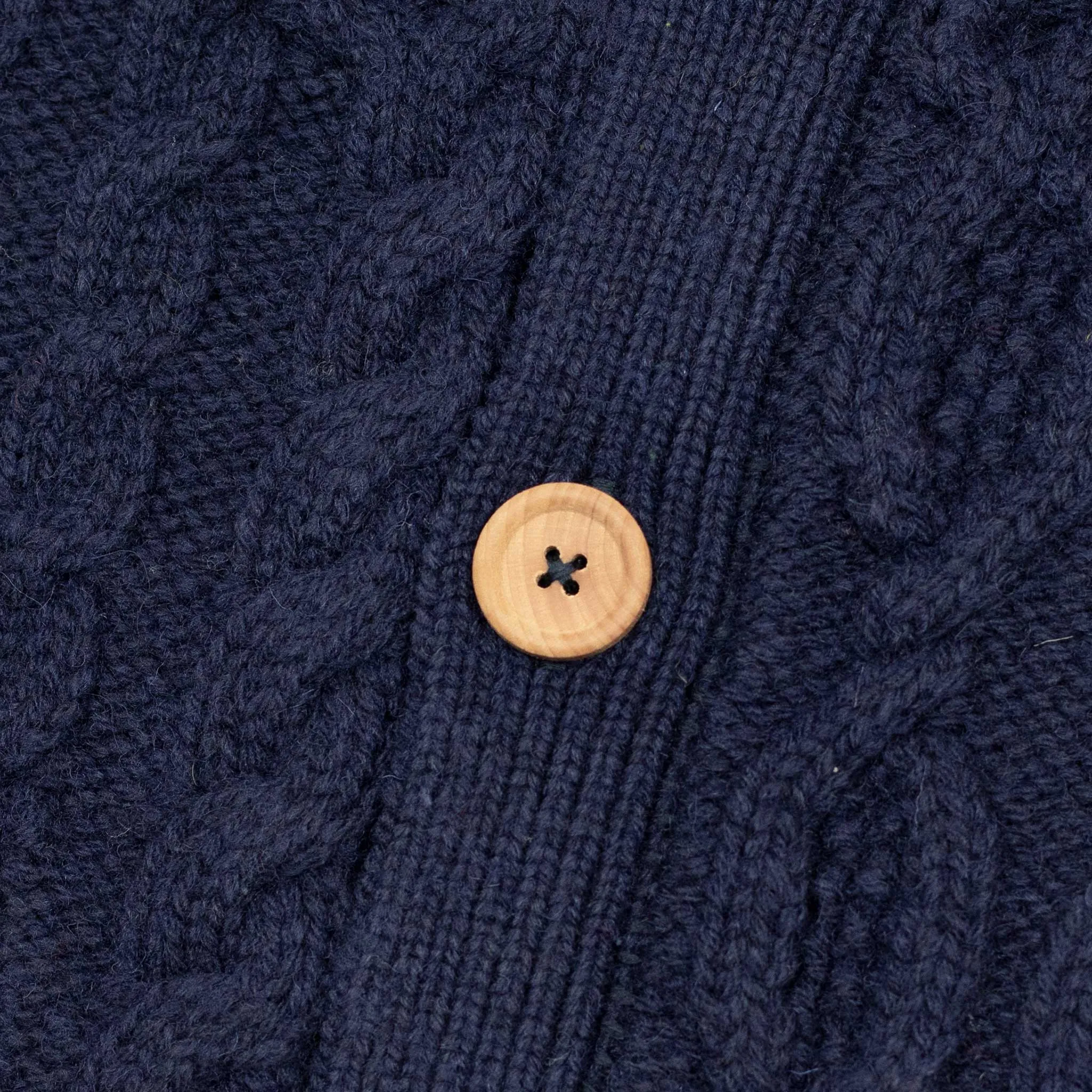 Crazy cable knit Aran cardigan in navy wool