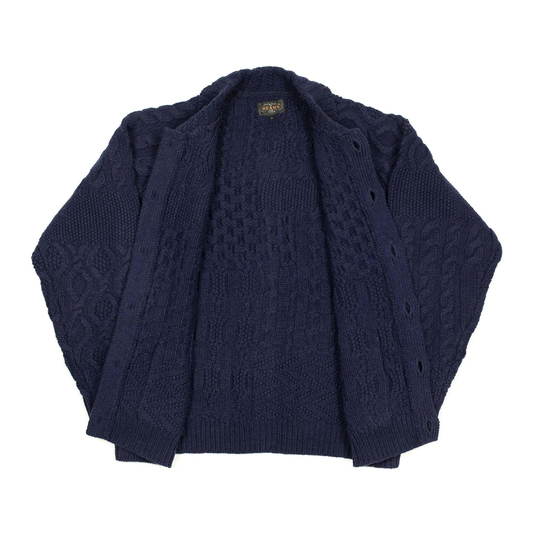 Crazy cable knit Aran cardigan in navy wool